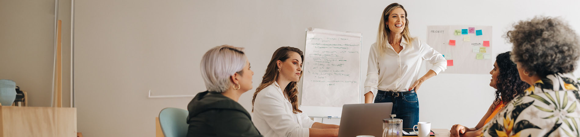 Woman standing in office meeting